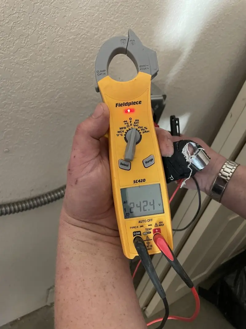 Voltage testing with clamp meter during Generator Installation in Wimauma